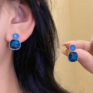Elegant silver needle earrings with square blue crystal pendants for women style