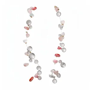 Multilayered acrylic beaded necklace with heart charms and vintage clock elements.
