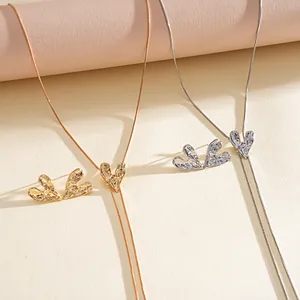 Detail of gold and silver wrinkled heart jewelry set with adjustable bolo necklace.