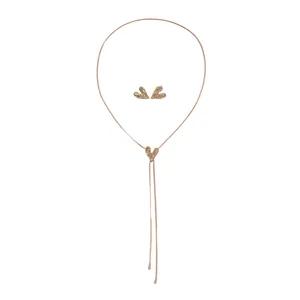 Gold-tone wrinkled heart pendant necklace and earring set with adjustable tassel slider