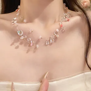 Close-up of a stylish multilayered acrylic beaded necklace worn on a model's neck