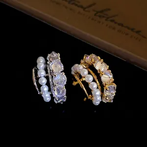 Elegant silver and gold ear cuffs with pearls and sparkling zircons for non-pierced ears