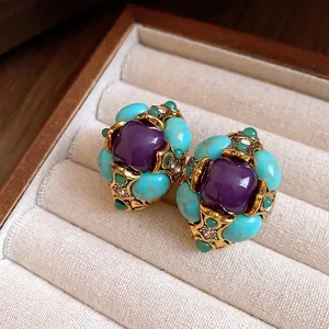 Vintage court style earrings with purple resin and turquoise stones in jewelry box