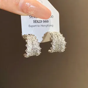 Elegant minimalist C-shaped stud earrings featuring sparkling rhinestones with silver needles