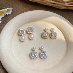 Elegantly designed vintage square zircon and pearl drop earrings in gold and silver.