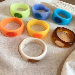 Chunky resin bracelets with marbled texture in vibrant colors for women
