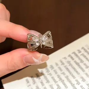 Detailed macro shot of a vintage silver butterfly open ring with sparkling zircon stones