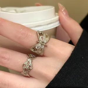 Detailed view of a vintage zircon butterfly open ring worn on elegant fingers for women.