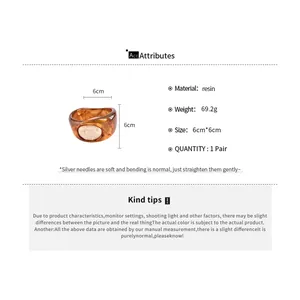 Detailed product attributes of a brown resin marbled bangle with 6cm dimensions.