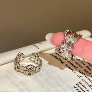 Close-up of vintage butterfly zircon ring with intricate detailing and silver finish.