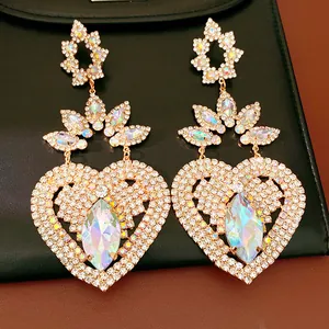 Ornate heart-shaped statement earrings with iridescent rhinestones and marquise stones