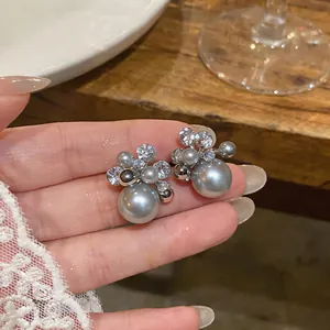 Detailed close-up showing elegant Korean style zircon stud earrings with grey pearls
