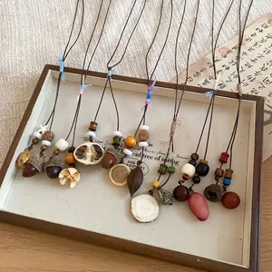 Artistic handmade acorn pendant necklaces in New Chinese style with natural wooden beads.