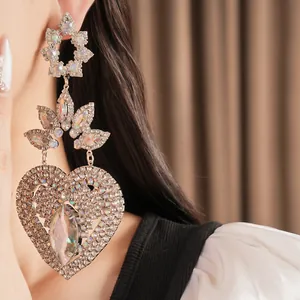 Close-up detail of luxury court style heart earrings with sparkling rhinestones.