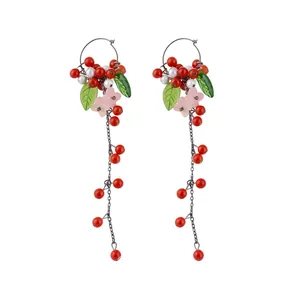 Elegant long tassel earrings with red berry, pearl, and floral design for women's gift.