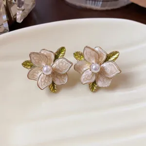 Elegant French floral pearl stud earrings with enamel petals and gold leaf detail