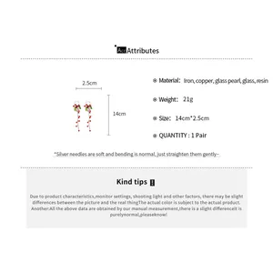 Detail showing material specifications and dimensions for floral tassel earrings.