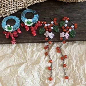 Close-up detail of vintage Chinese style earrings with floral tassels and colorful beads