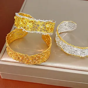 Elegant French vintage lace hollow cuff bracelets with intricate gold and silver plating.