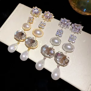 Elegant silver needle drop earrings with square rhinestones and oval pearl beads