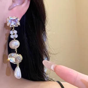 Elegant long tassel earrings featuring sparkling crystals and pearlescent beads