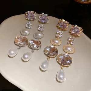 Elegant vintage drop earrings with square rhinestones and pearls on silver needles for women.