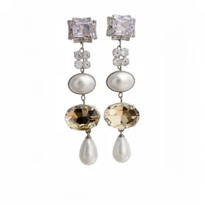 Elegant silver needle drop earrings featuring pearls and faceted amber crystals for women