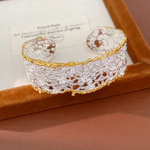 Detailed view of French vintage lace hollowed-out cuff bracelet in two-tone finish