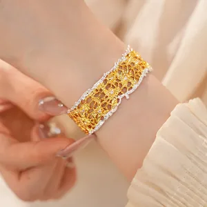 Close-up view of a French retro lace-edge openwork bracelet worn on a female wrist.