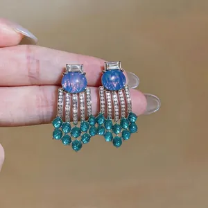 Elegant vintage tassel earrings featuring blue resin stones and green beaded fringe
