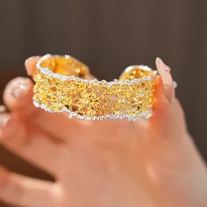 Detailed macro view of French vintage style hollow-out lace gold silver mixed cuff bracelet
