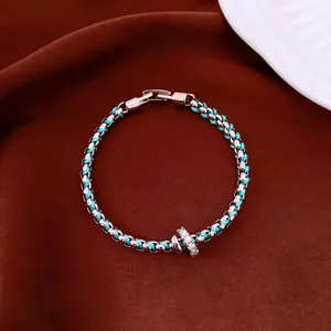 Vintage luxury lake blue woven bracelet with minimalist silver-tone metal links for women