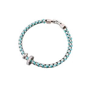 Elegant lake blue braided bracelet featuring a crystal-encrusted sliding ring detail