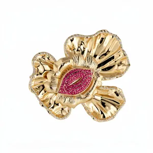 Vintage gold flower bangle with red rhinestone lip center and sparkling crystal edges.