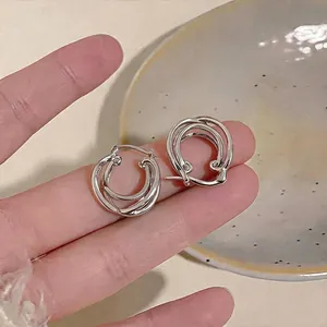 Elegant silver-colored double-layer cross hoop earrings with a minimalist design for women