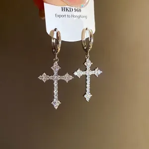 Elegant zircon-encrusted cross pendant hoop earrings in a shimmering silver-toned finish