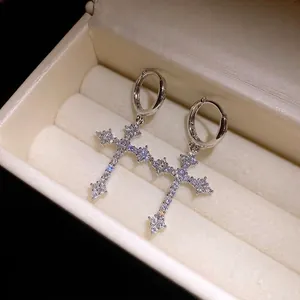 Elegant silver-tone zircon cross hoop earrings in a luxury jewelry box