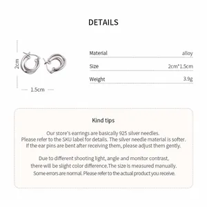 Detail view of silver crossed hoop earrings with material and dimension information.