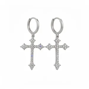 Elegant silver-tone hoop earrings with micro-pave cubic zirconia cross pendants.