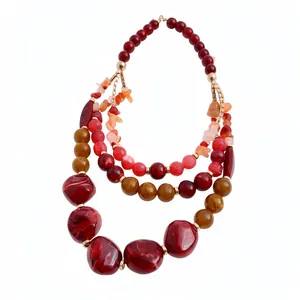 Multi-layer beaded necklace with red and amber resin stones in a luxury bohemian design