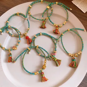 Hand-woven colorful five-color rope bracelet with traditional charms and silk tassels