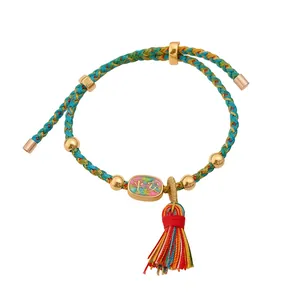 Handmade colorful braided rope bracelet with gold pendant and tassel for good luck