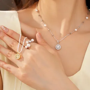 Close-up detail of elegant zircon eight-pointed star pendant necklace worn by model