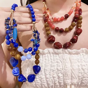 Elegant bohemian multi-layer beaded necklace featuring natural agate stones and resin accents