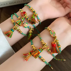 Detailed macro shot of handmade woven Dragon Boat Festival colorful rope bracelets with tassels