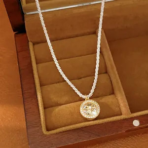 Detailed shot of an elegant zircon eight-pointed star pendant necklace in a gift box.