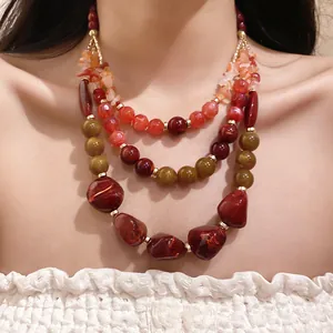 Macro detail of a luxurious multi-layer agate and resin beaded necklace for women