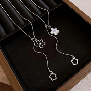 Elegant silver-tone flower pendant adjustable pull-style necklace in a luxury jewelry box