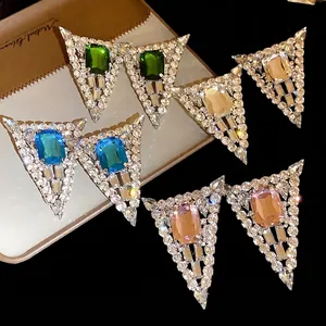 Elegant geometric triangle stud earrings with shiny crystals and colorful gemstones.