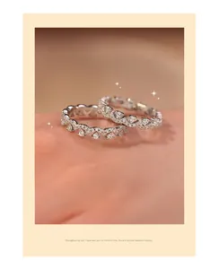 Close-up macro view of two zircon scalloped crown rings with sparkling details